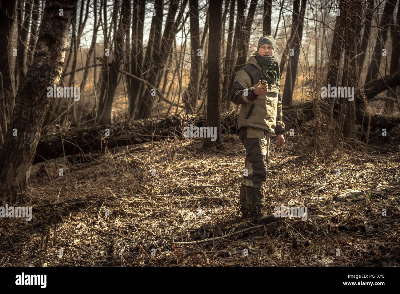 Hunter man autumn forest with transmitter during hunting season Stock Photo