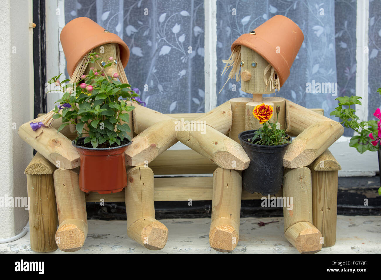 Creative wooden, handmade DIY sculpture of the tv characters Bill and Ben  the flowerpot men, on a windowsill of an old house in Hastings, East Sussex  Stock Photo - Alamy