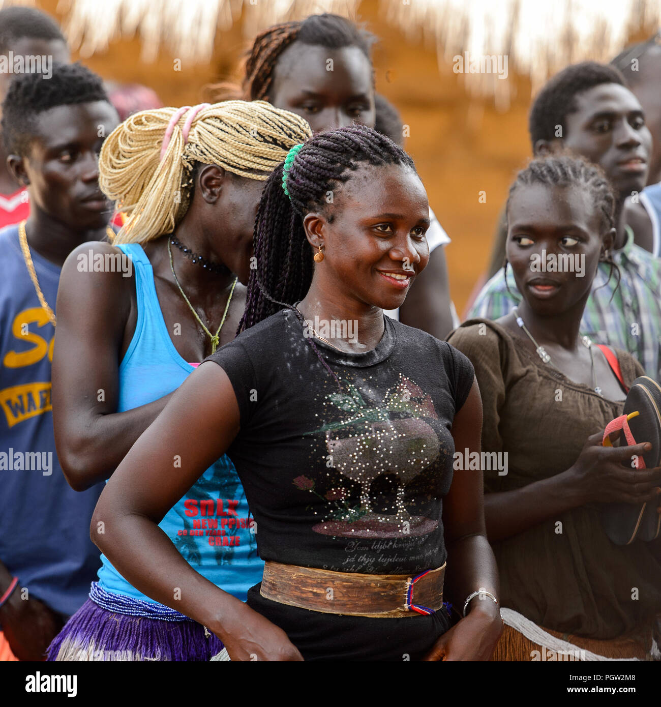 ORANGO ISLAND, GUINEA BISSAU - MAY 3, 2017: Unidentified local people stand in the Etigoca village. People in G.-Bissau still suffer of poverty Stock Photo