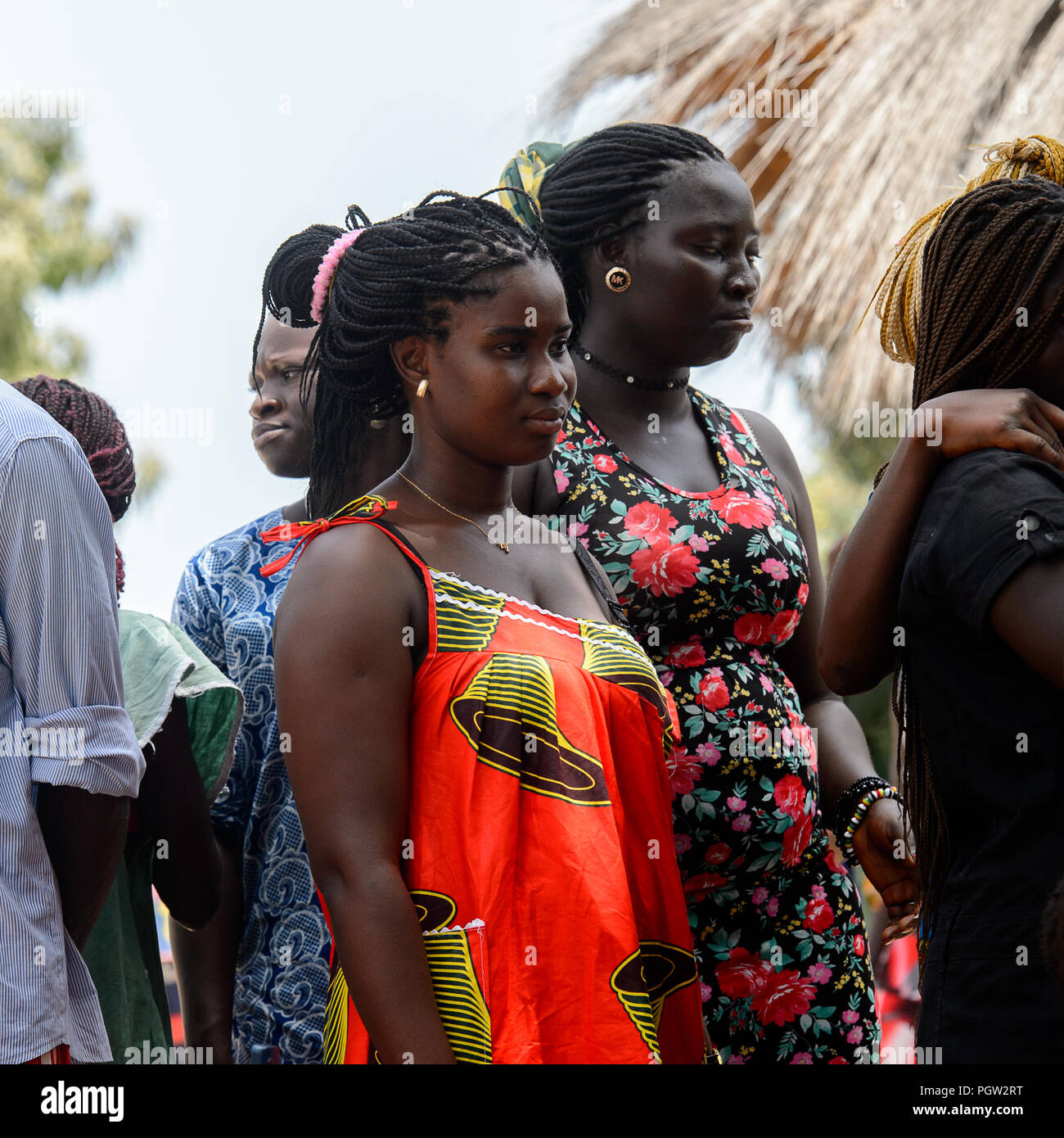 ORANGO ISLAND, GUINEA BISSAU - MAY 3, 2017: Unidentified local people stand in the Etigoca village. People in G.-Bissau still suffer of poverty Stock Photo