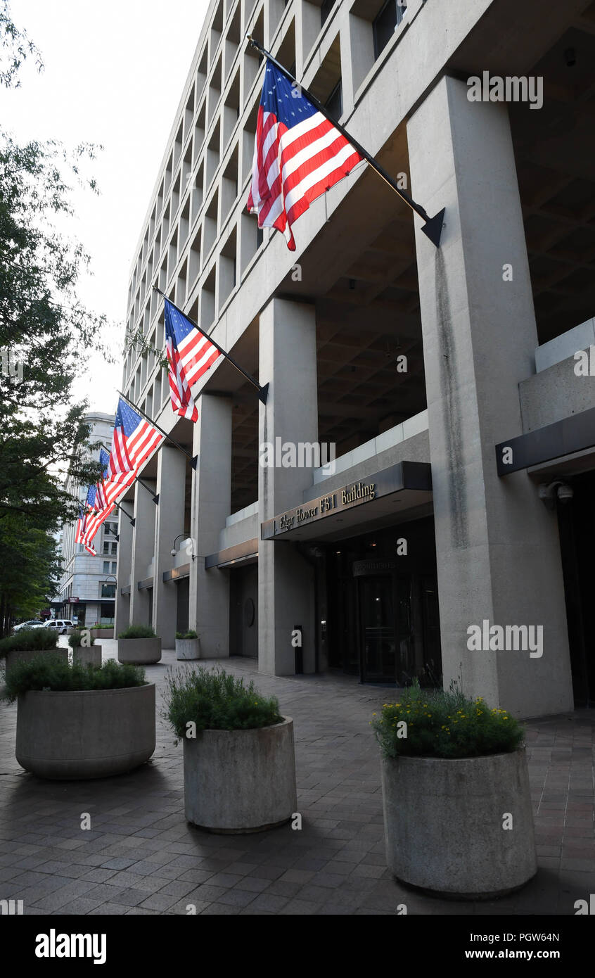 American flags fly from the J. Edgar Hoover F.B.I. Building in Washington, D.C., USA. Stock Photo