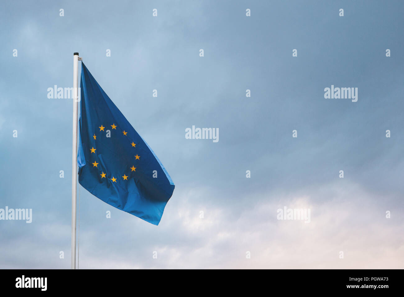 Flag of the European Union on the flagpole against the backdrop of the ...
