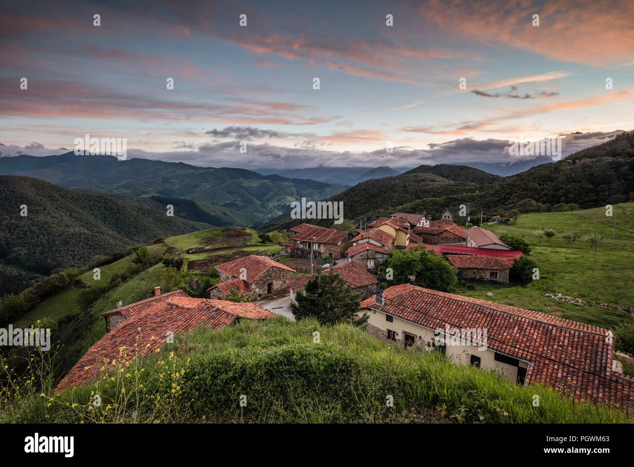 Mountain village Cahecho with typical red tiled roofs, sunset, village Cahecho, near Potes, Picos de Europa, Cantabria, Spain Stock Photo
