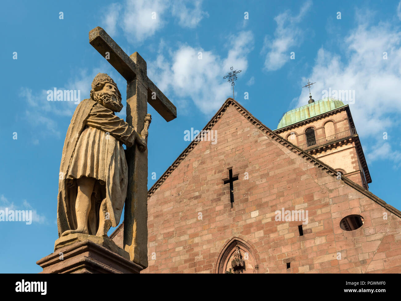 Statue on top of Emperor Constantin Fountain in front of Sainte Croix church in Kaysersberg, France Stock Photo