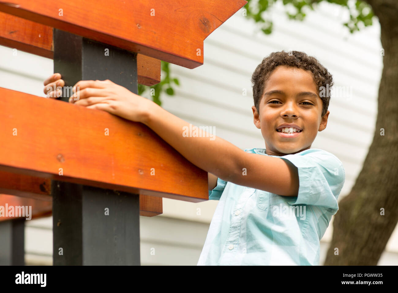 Young mixed race little boy playing and smiling. Stock Photo