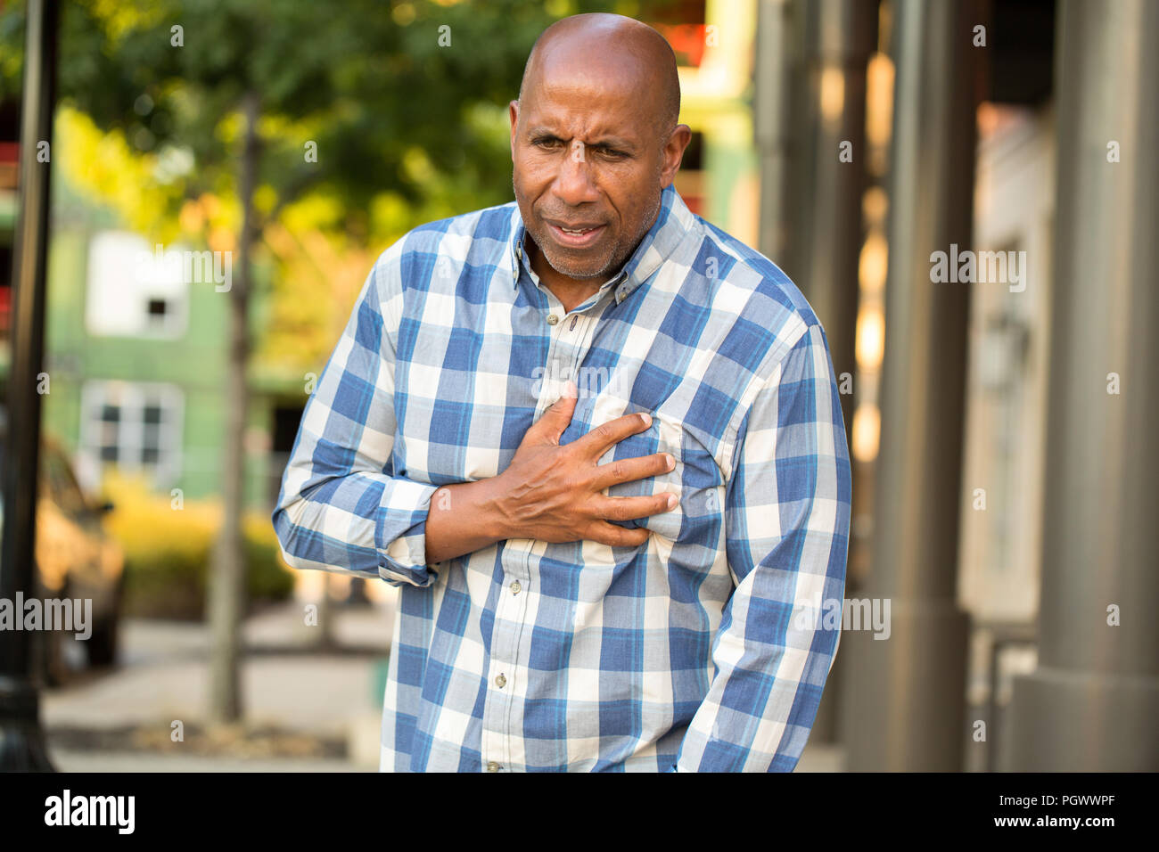 African man holding chest pain hires stock photography and images Alamy