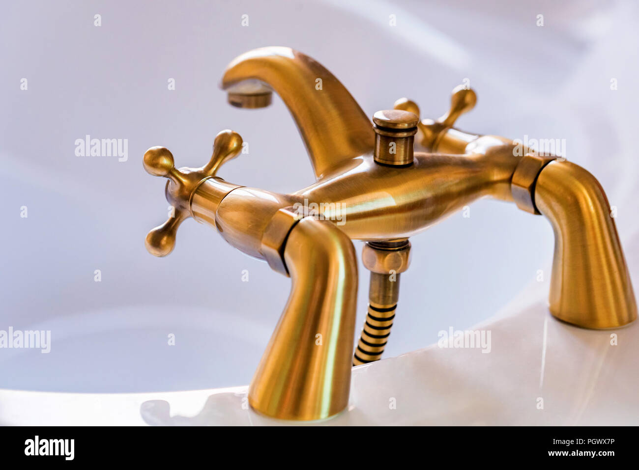 Modern brass or bronze tap for bathroom Stock Photo Alamy