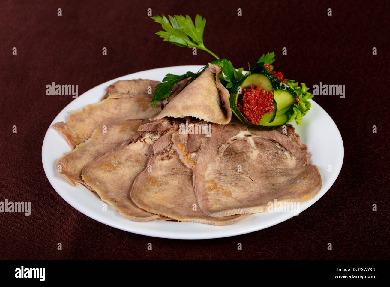 Sliced beef tongue with spicy sauce Stock Photo Alamy