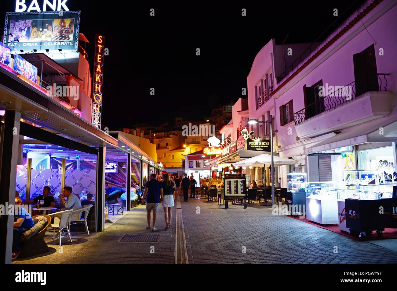 Bars and restaurants leading to the Largo Duarte Pachero Square in the old  town at night with tourists enjoying the setting, Albufeira, Portugal, Euro  Stock Photo - Alamy