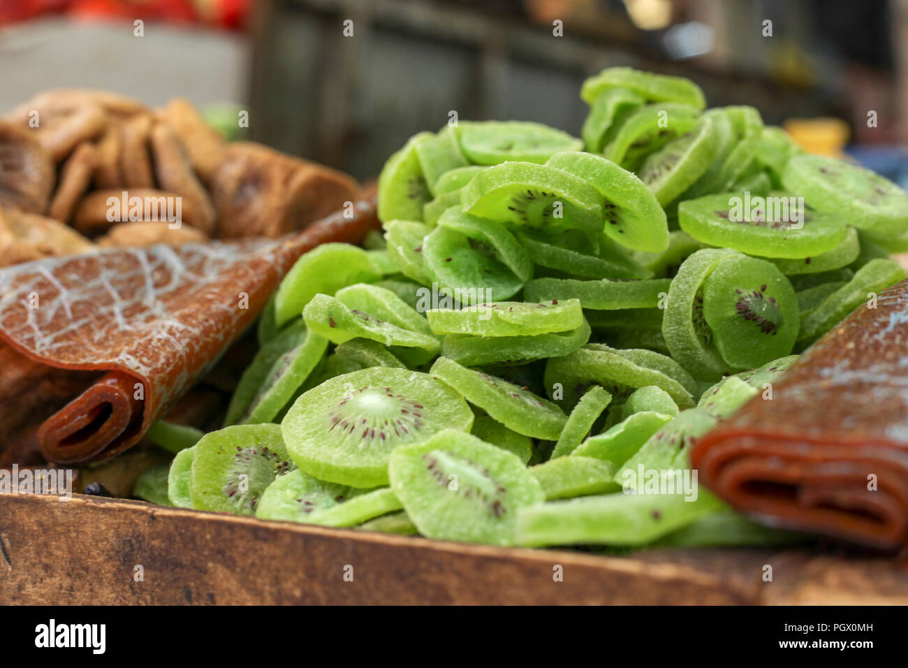 Dried fruit (Kiwi and Apricot) on display at a stall in a market Stock