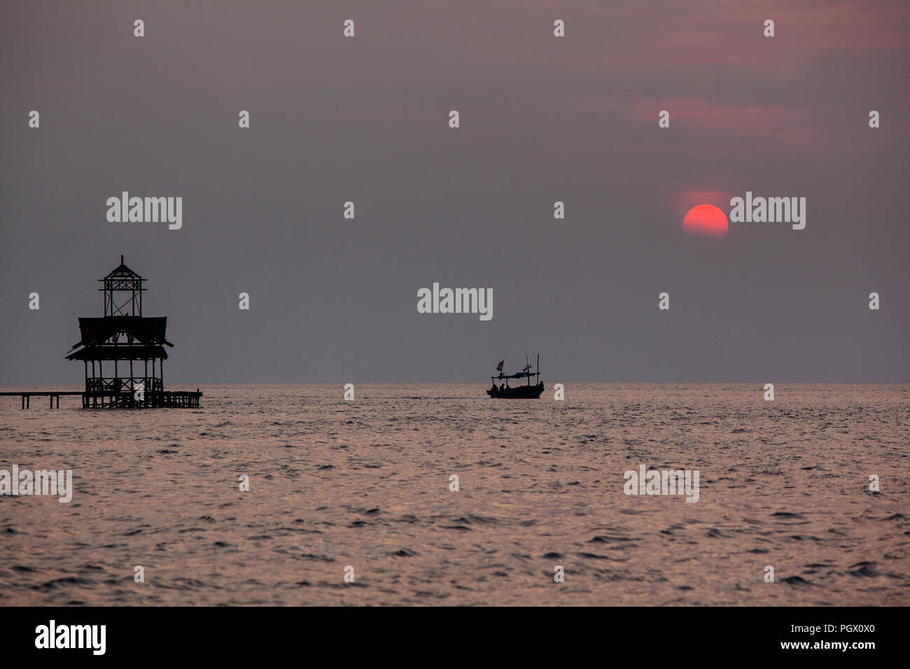 Sunset across the Java Sea on Indonesia's Thousand Islands. Stock Photo