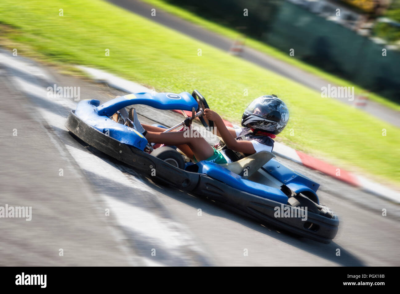 Driver Racing with Go Kart on outdoor circuit Stock Photo Alamy