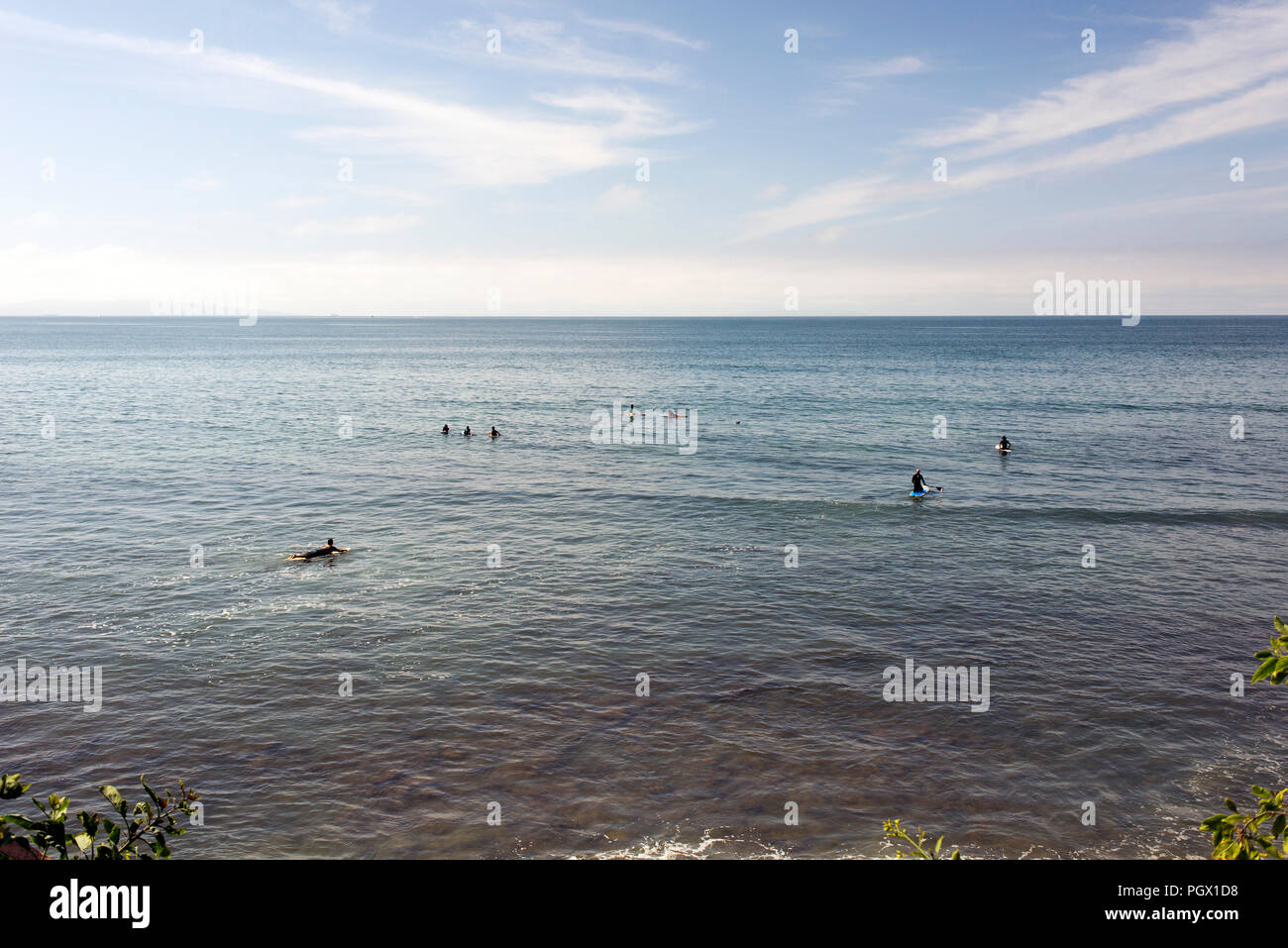 Surfers in Malibu beach, waiting for the waves in summer time in California Stock Photo