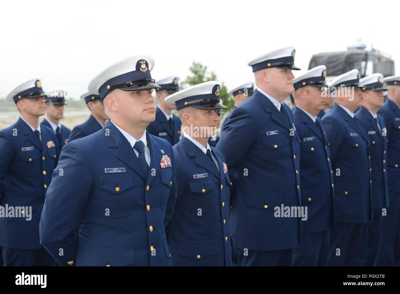 Personnel from Coast Guard Station Cape Disappointment stand in ...