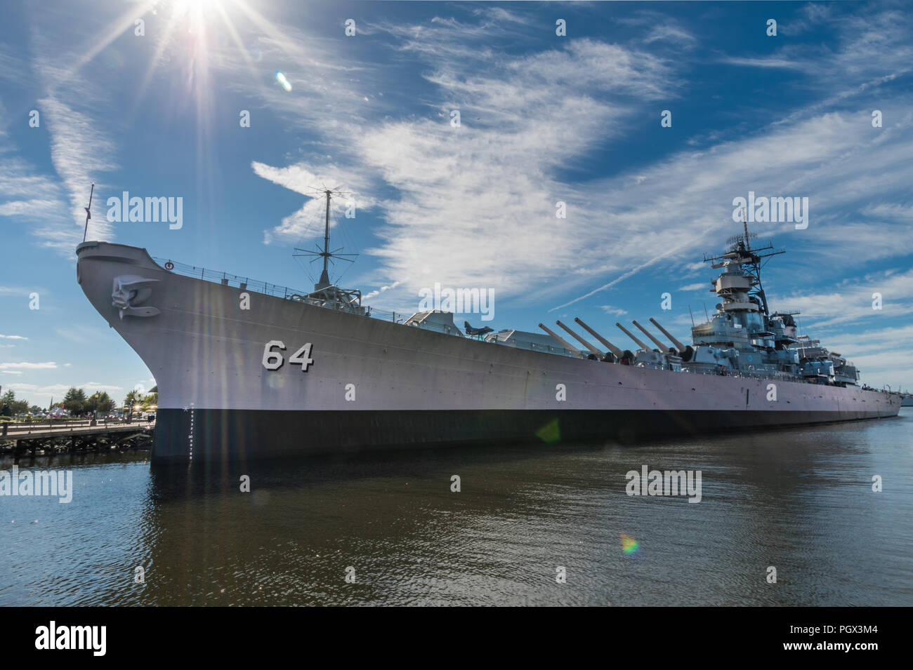 The Battleship Wisconsin at dock in Norfolk Virginia under a bright sunny sky Stock Photo