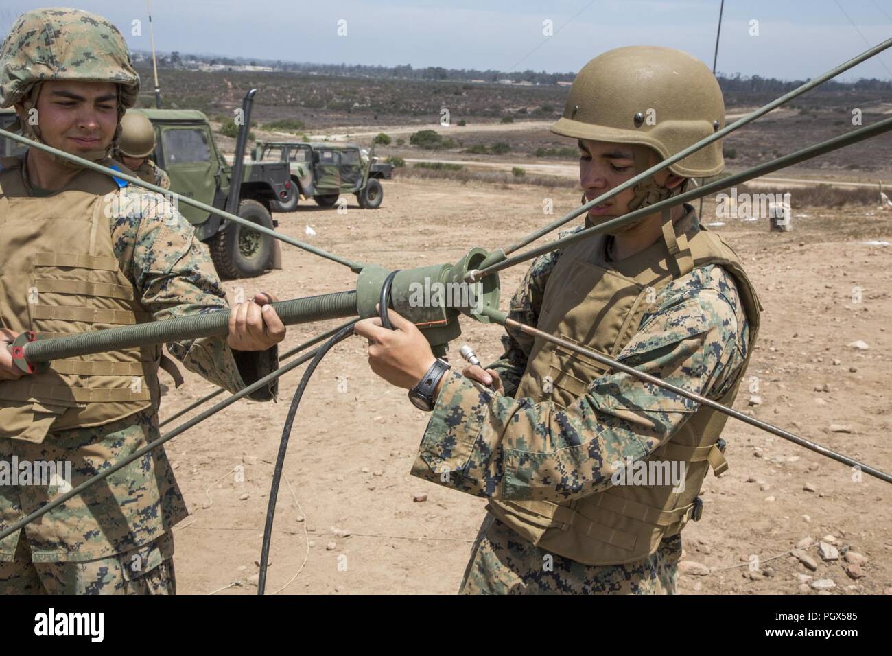 Marines with Marine Wing Communication Squadron 48, 4th Marin Aircraft Wing, build an OE-254 very high frequency voice communication antenna during Communication Exercise (COMMEX) at Marine Corps Air Station Miramar, Calif., June 15. COMMEX is an annual training drill period for reserve Marines to practice and hone their skills in their military occupational specialties, and to establish and maintain long-range communications. Stock Photo