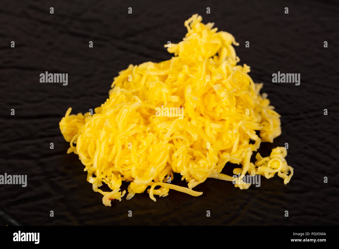 https://c8.alamy.com/comp/PGX5MA/shredded-yellow-cheese-topping-heap-PGX5MA.jpg