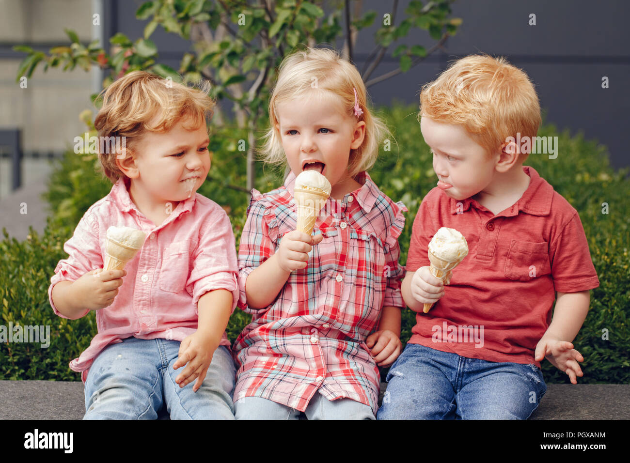 Group portrait of three white Caucasian cute adorable funny children toddlers sitting together sharing ice-cream food. Love friendship fun concept. Be Stock Photo - Alamy Group portrait of three white Caucasian cute adorable funny children toddlers sitting together sharing ice-cream food. Love friendship fun concept. Be Stock Photo - Alamy