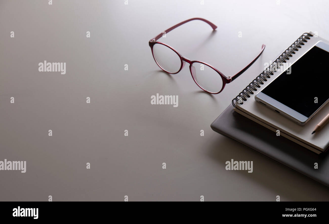 workplace with laptop computer and office supply on the white table in