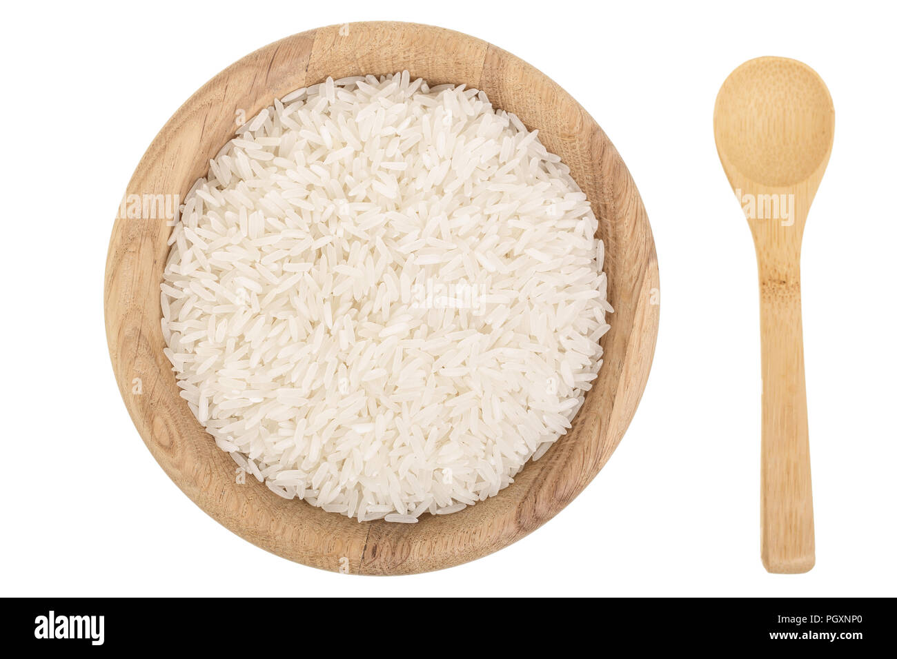 rice grains in wooden bowl isolated on white background. Top view. Flat