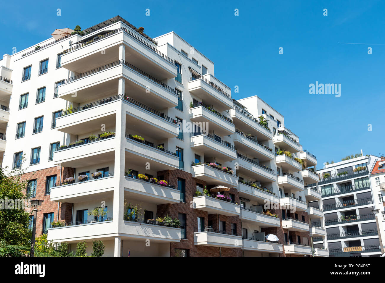 White apartment house with big balconies seen in Berlin, Germany Stock ...