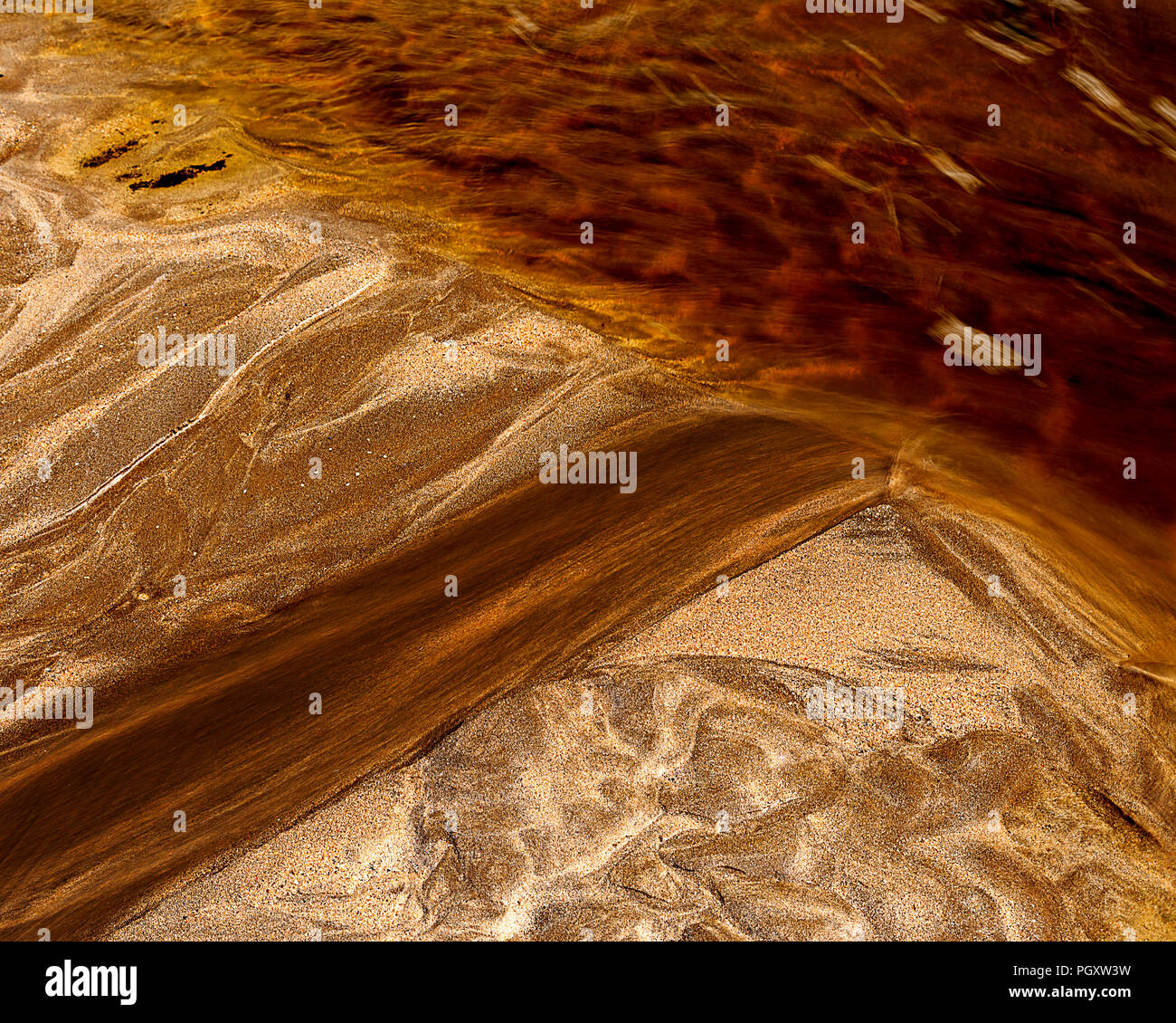Patterns in the sand at Solva beach, Pembrokeshire, on the coast of Wales Stock Photo