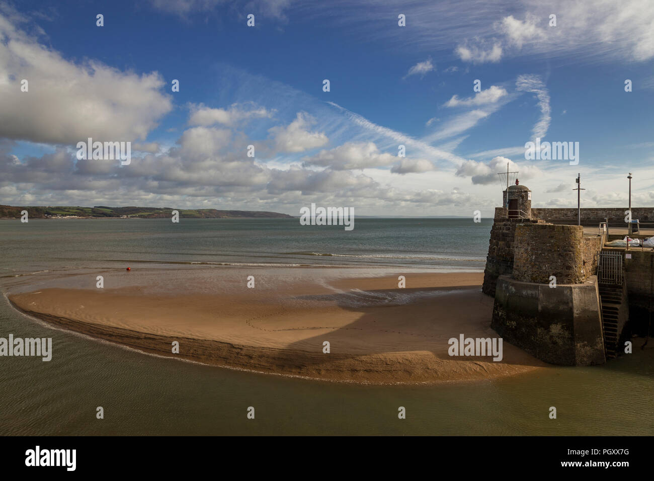 Beach and harbour wall at Saundersfoot on the Pembrokeshire coast of Wales Stock Photo