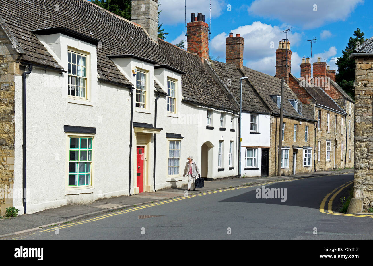 Street of terraced houses in Thrapston, Northamptonshire, England UK