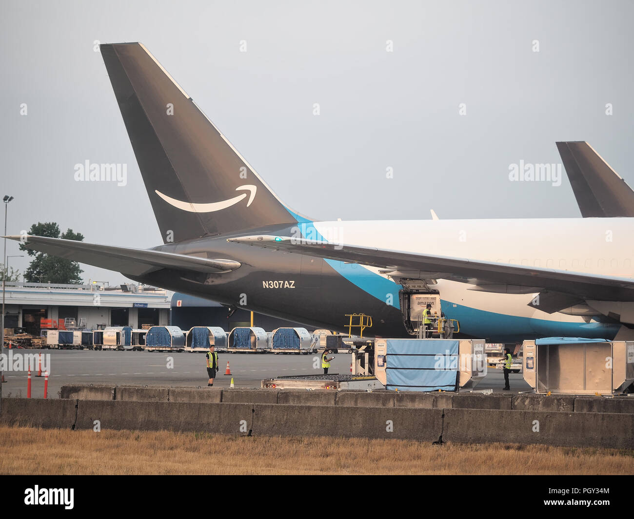 Amazon Prime Air cargo aircraft loading at Seattle–Tacoma International Airport in August 2018 Stock Photo