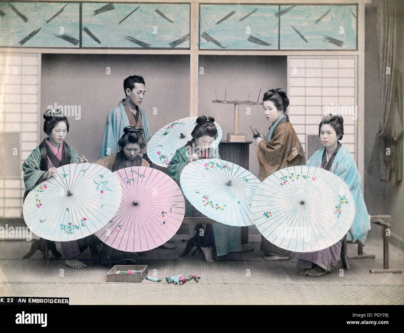 [ 1890s Japan - Parasol Embroiderers ] —   Women in kimono and traditional hairdos embroider parasols.  19th century vintage albumen photograph. Stock Photo