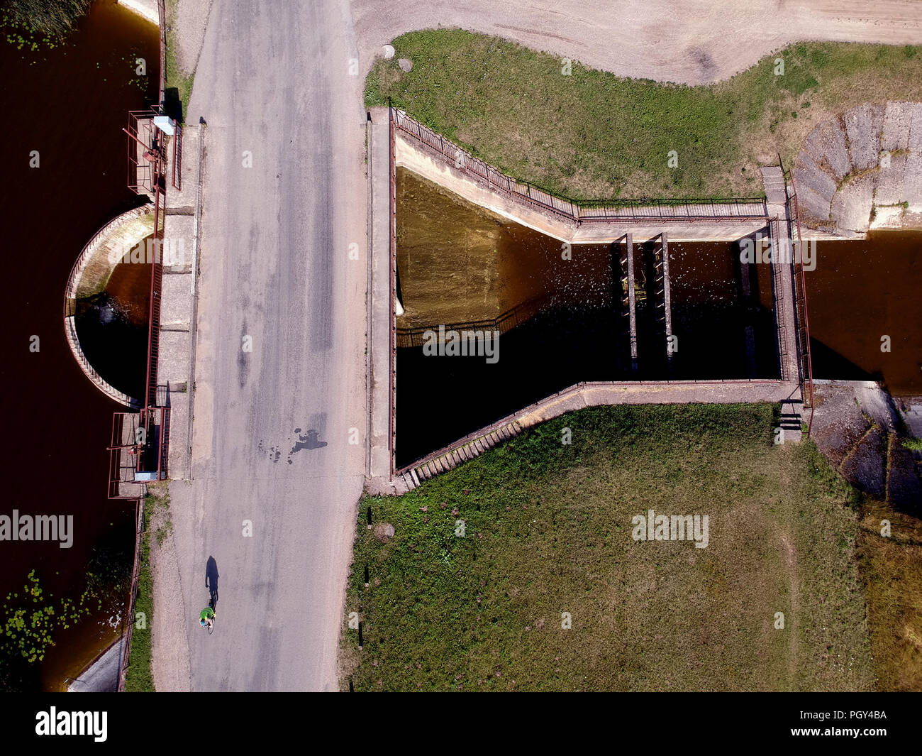 summer time river dam with small water splash from drone, aerial view Stock Photo