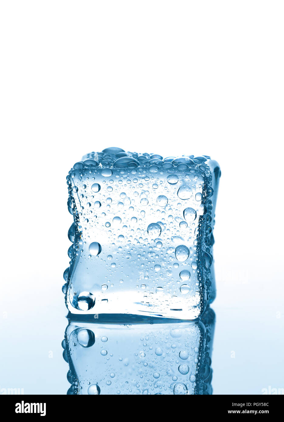 Single ice cube with water drops on white background with reflection Stock  Photo - Alamy