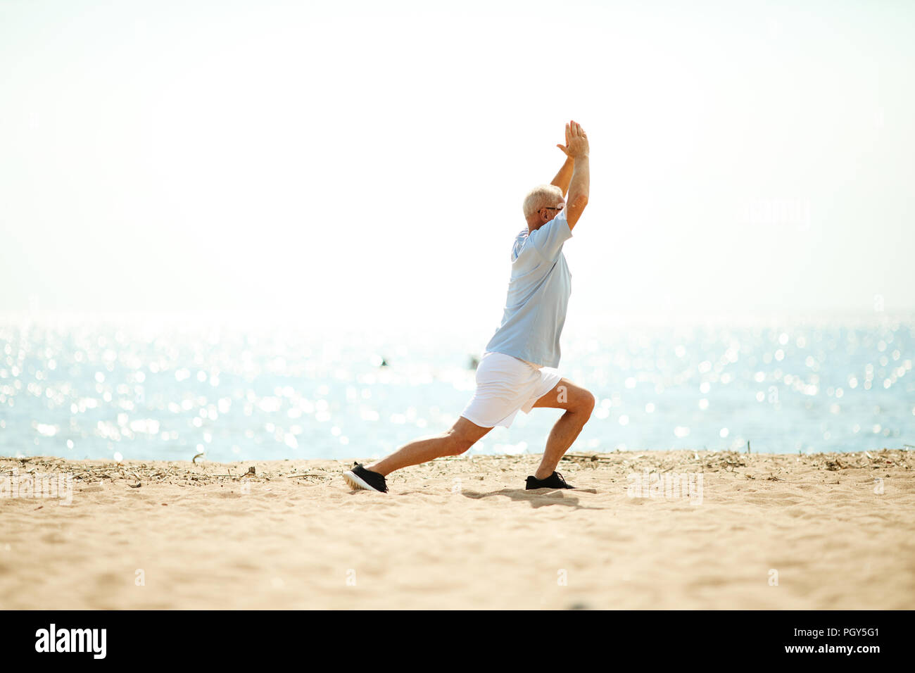 Beach stretching man legs hi-res stock photography and images - Alamy