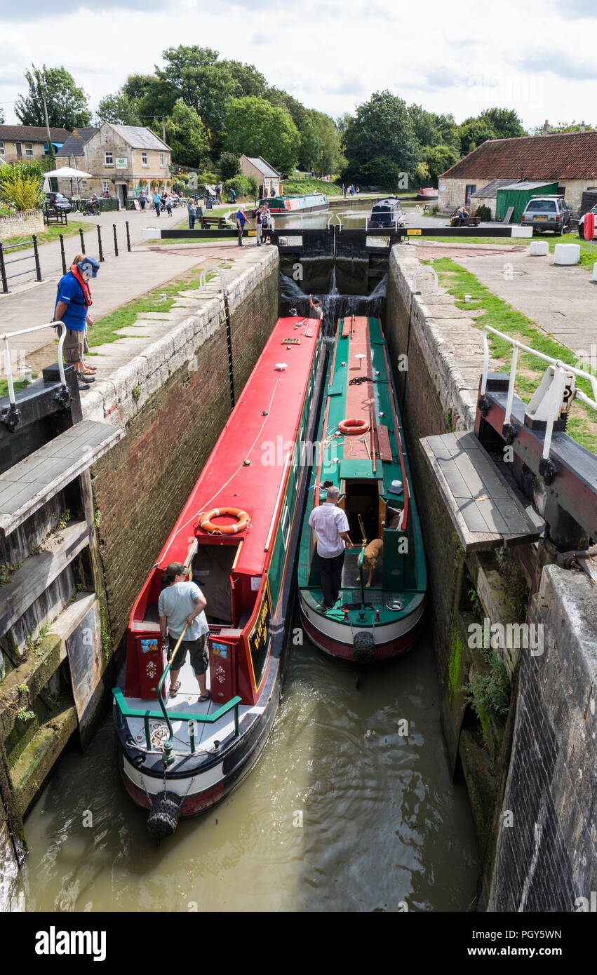 Two narrowboats at the lockgates, Bradford on Avon Wharf, Kennet and Avon Canal, Wiltshire, England, UK Stock Photo