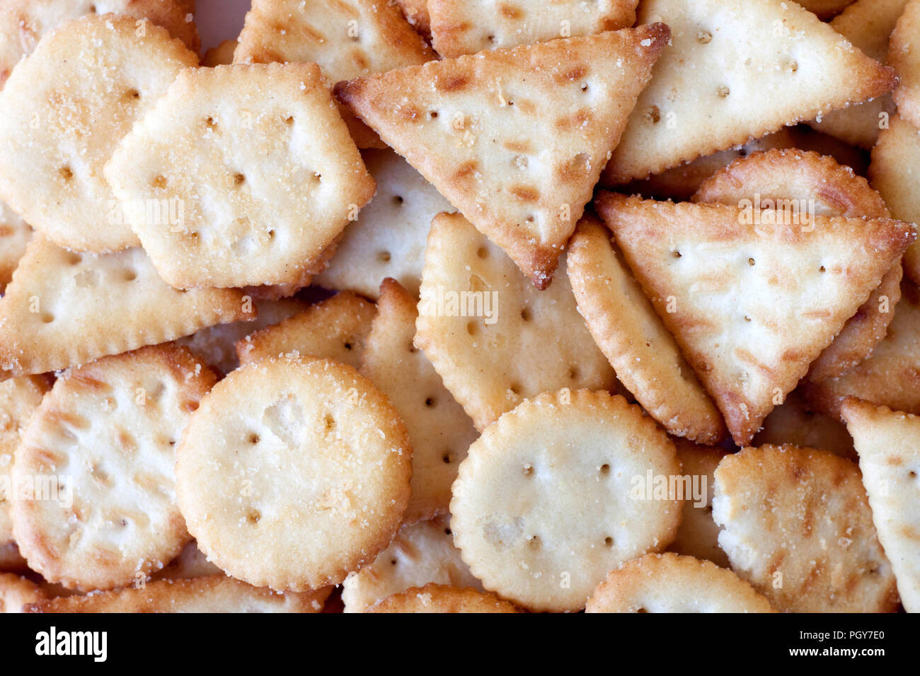Lots of saltet golden mini crackers backround Stock Photo