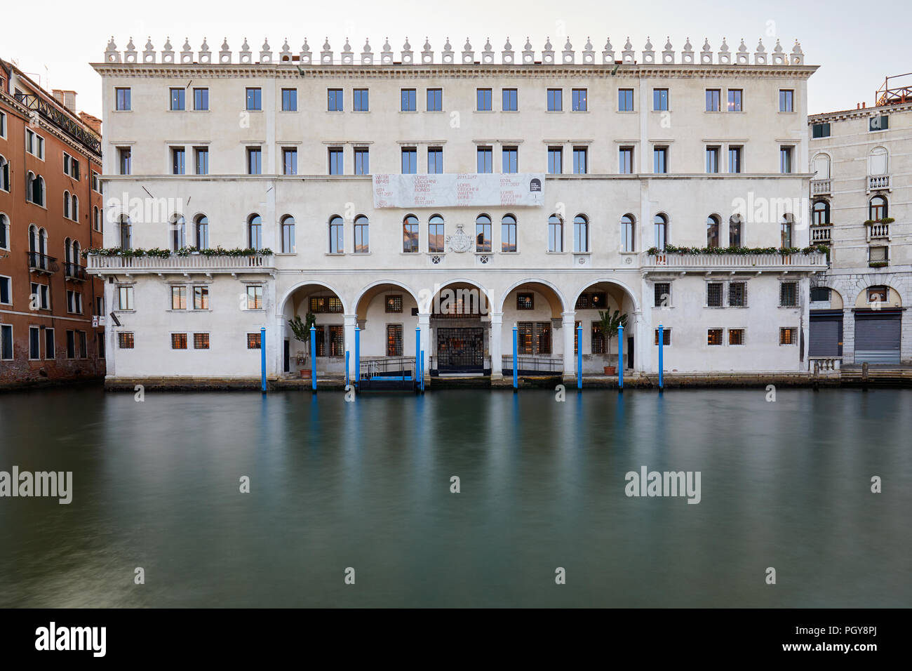 VENICE, ITALY - AUGUST 15, 2017: Fondaco dei Tedeschi, luxury department store building with grand canal in the early morning Stock Photo