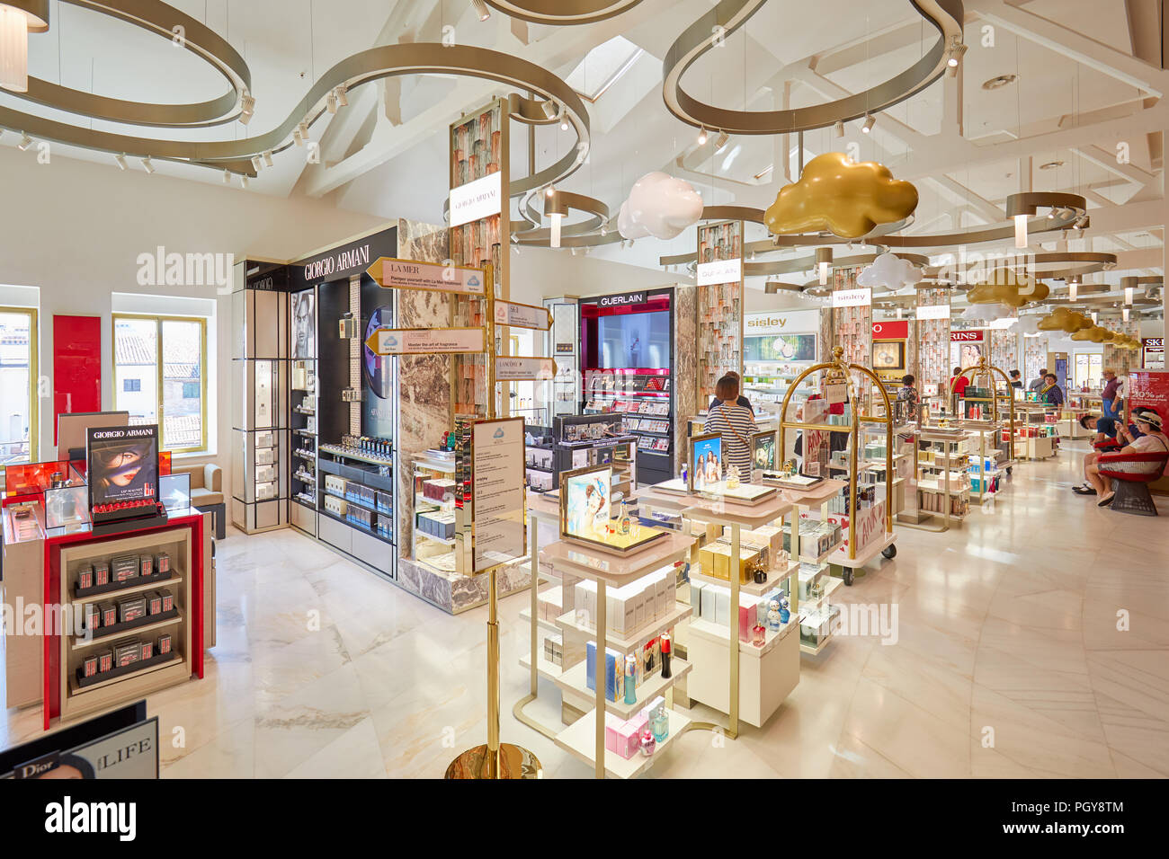 VENICE, ITALY - AUGUST 15, 2017: Fondaco dei Tedeschi, luxury department store interior, cosmetics and perfums area with people Stock Photo