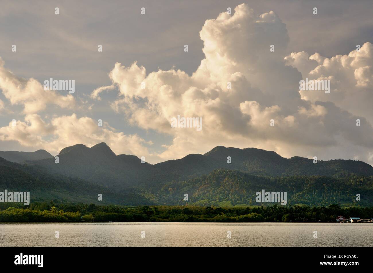 Cumulus clouds in sunset sky over Koh Chang island, Thailand. Stock Photo