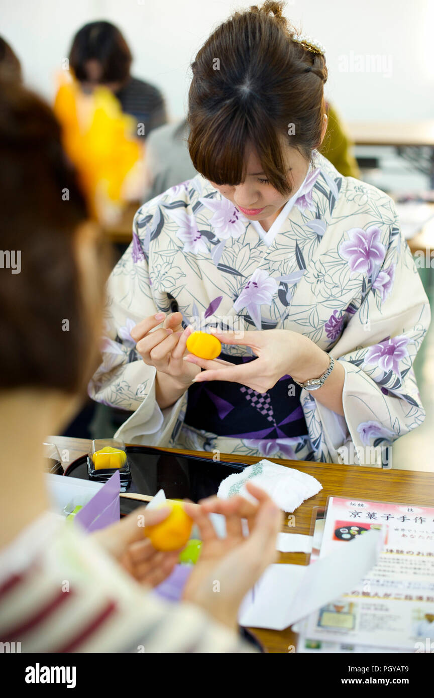 Visitors try their hand at making Kyoto wagashi sweets during a class