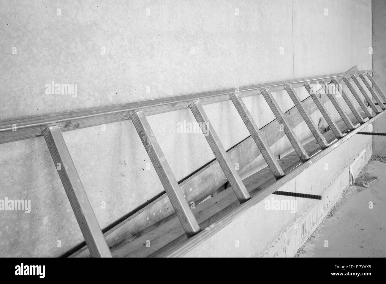 Ladder on concrete wall, construction site Stock Photo Alamy