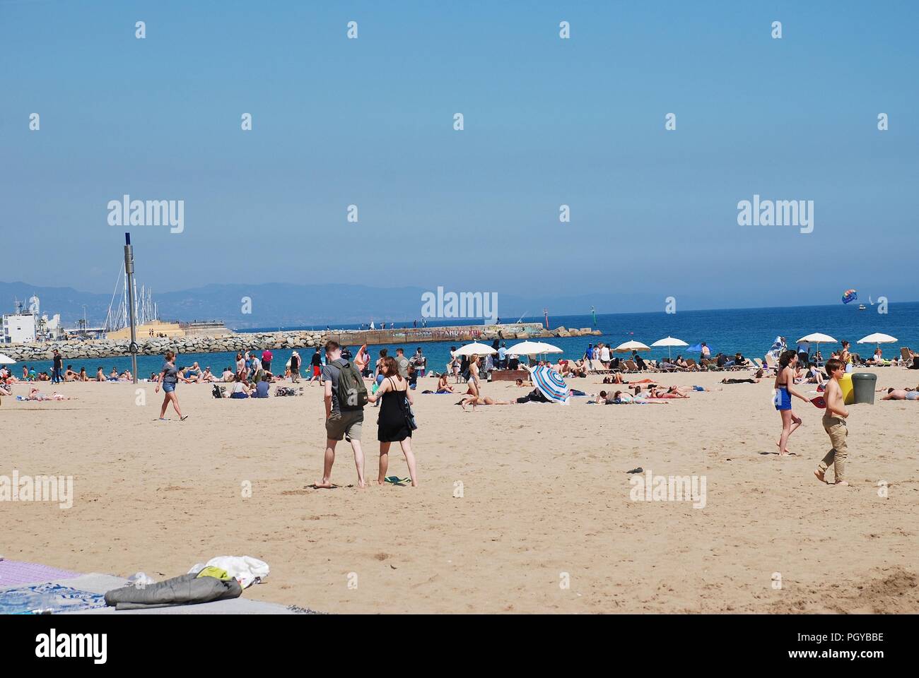 People enjoying the beach at Barcelona in Catalonia, Spain on April 17, 2018. Stock Photo