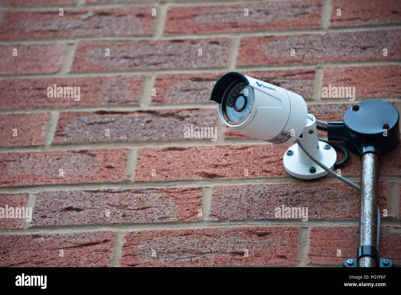 swann security camera fitted to the front of a brick built house Stock Photo