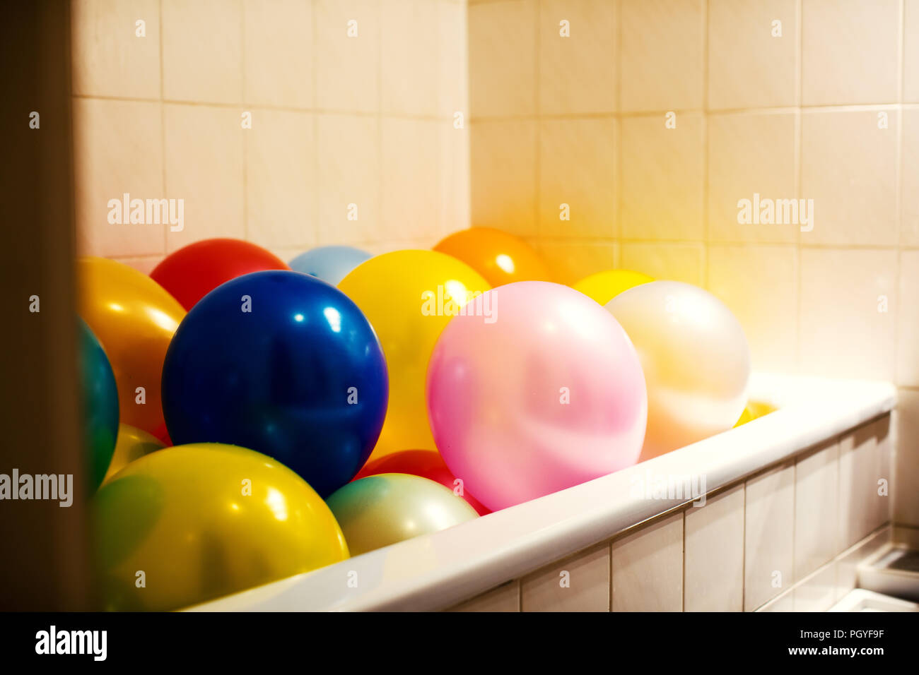 Bath tub full of balloons Stock Photo Alamy