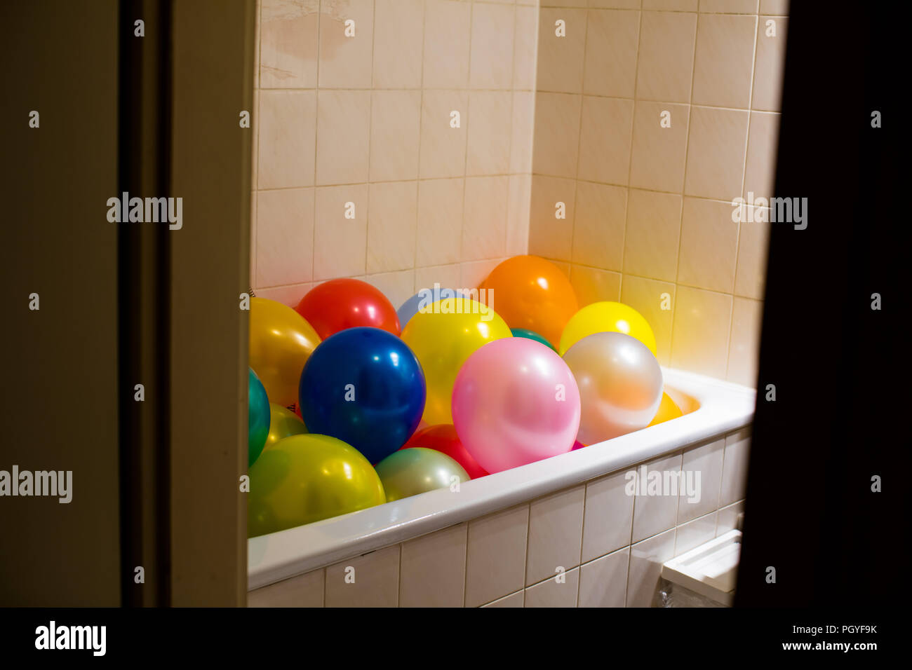 Bath tub full of balloons Stock Photo Alamy