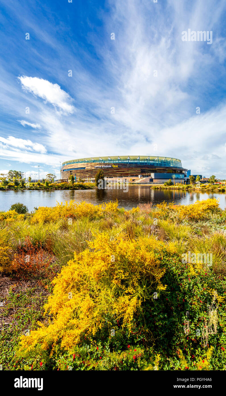 Optus Stadium and Stadium Park with native plants growing beside a lake Stock Photo