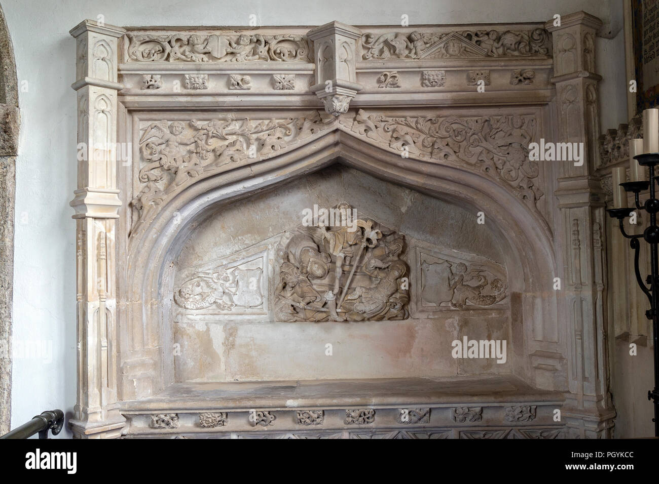 Chancel of Holcombe Burnell Parish Church looking eastwards, showing the 16th-century Easter Sepulchre monument to a member of the Denys family, north Stock Photo