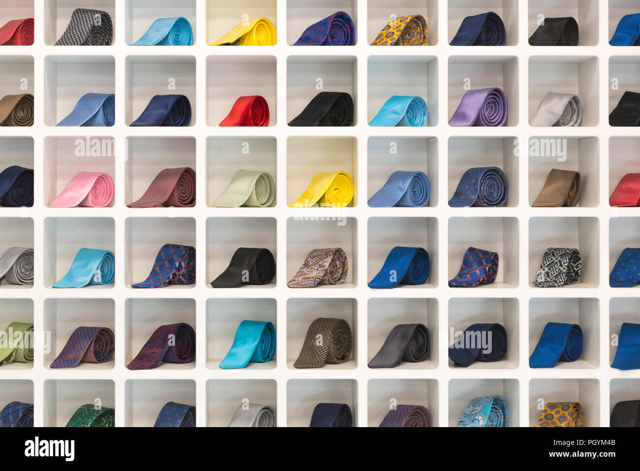 Neckties arranged in a grid shelf Stock Photo