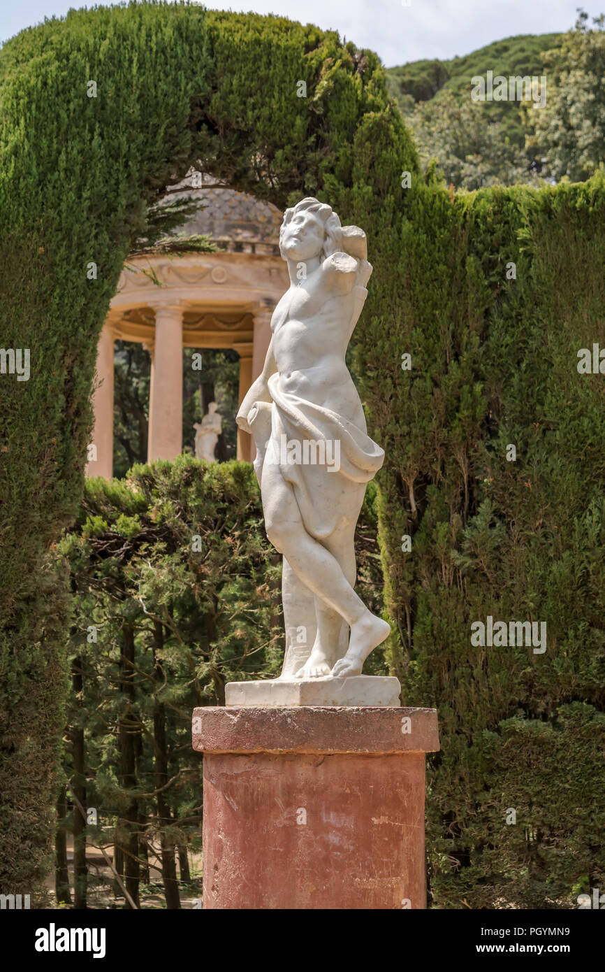 Statue of Eros, the Greek god of love, in the center of Labyrinth Park of Horta. Made of marble, it measures 1.40 m high Stock Photo