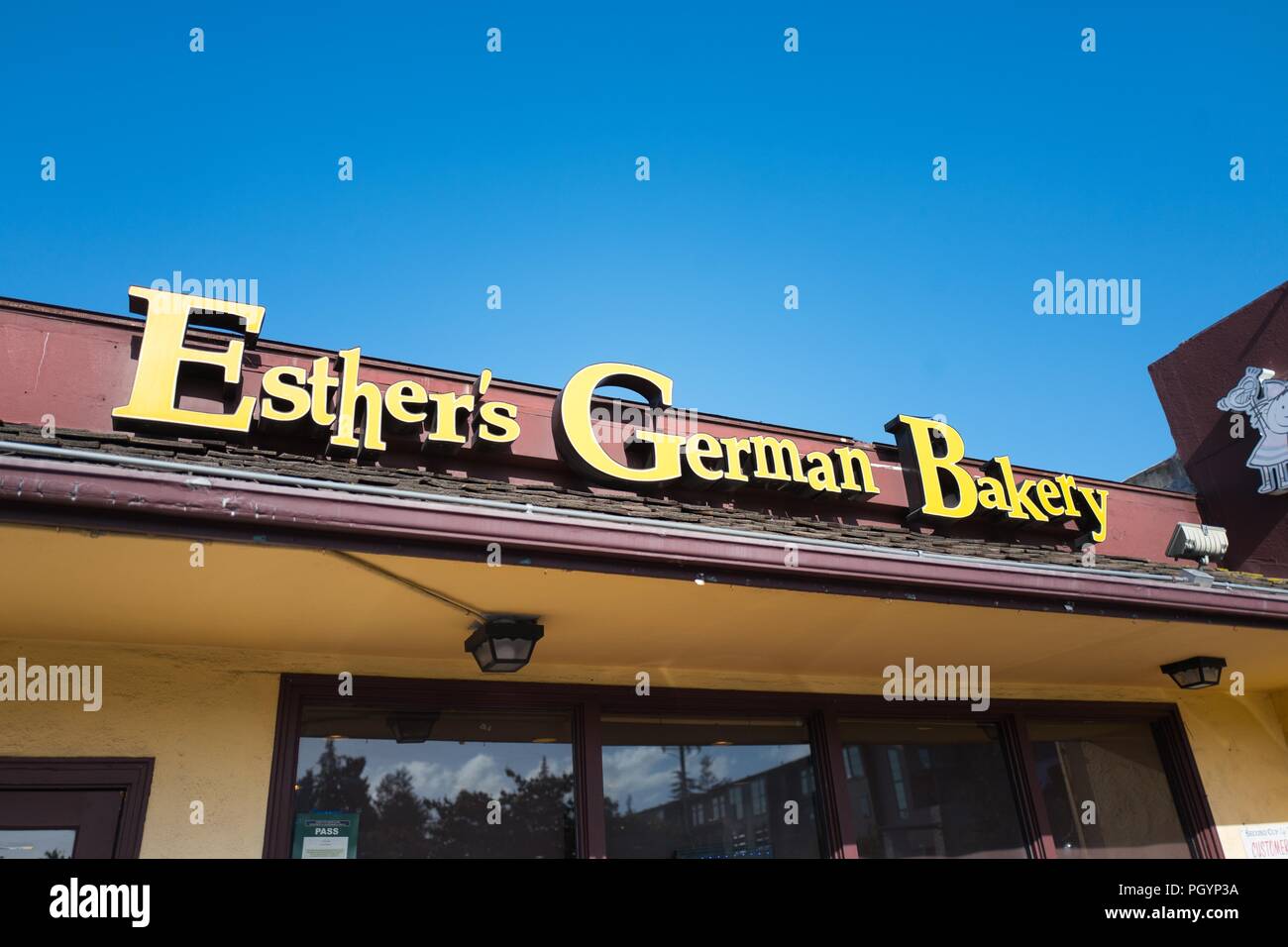 Sign on facade of Esther's German Bakery, a German cuisine restaurant and bakery which is popular among technology workers and is known for being a favorite of Facebook founder Mark Zuckerberg, in the Silicon Valley, Los Altos, California, May 30, 2018. () Stock Photo