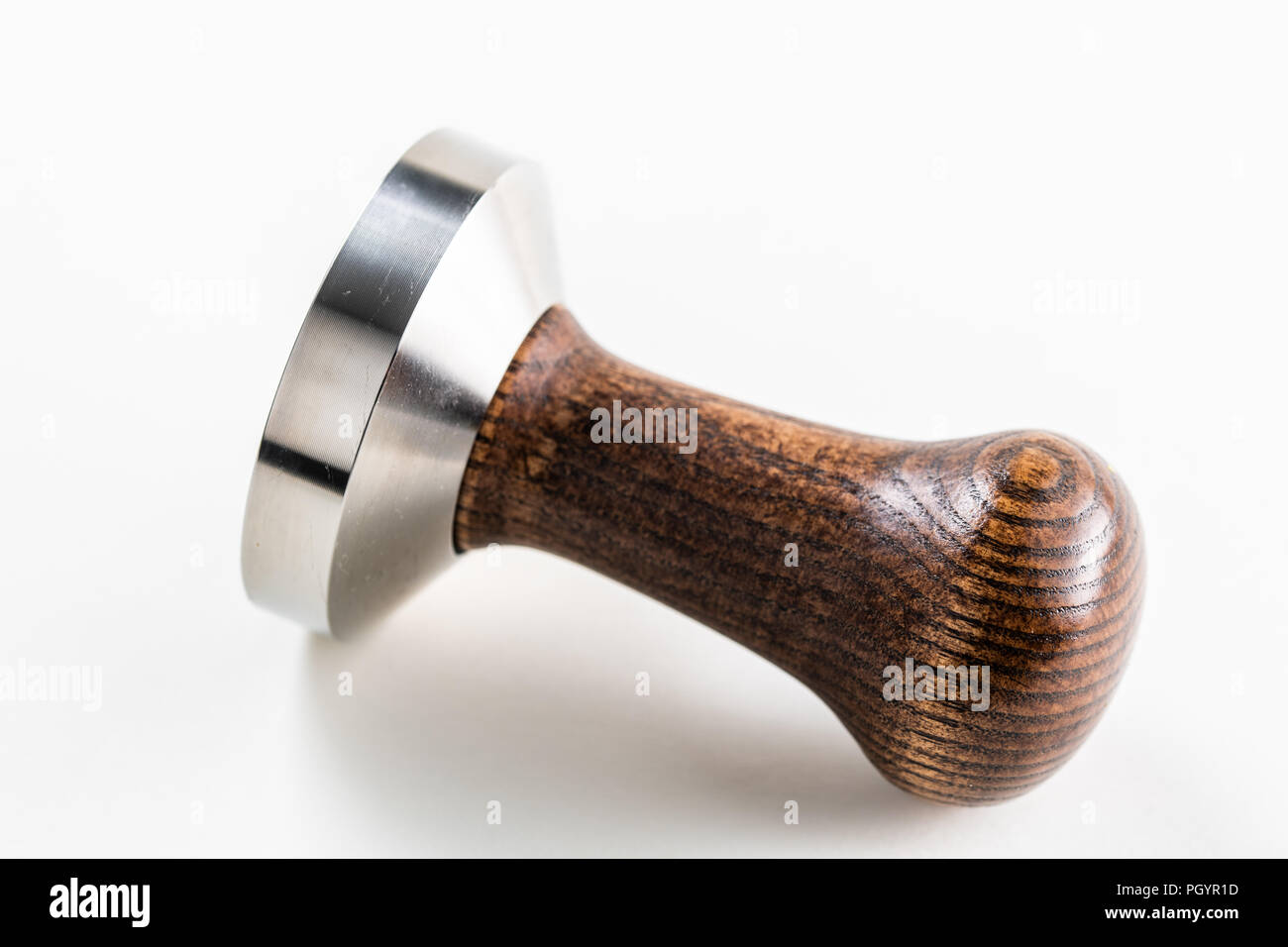 A coffee or espresso tamper that might be used by a barista in a coffee shop Stock Photo Alamy